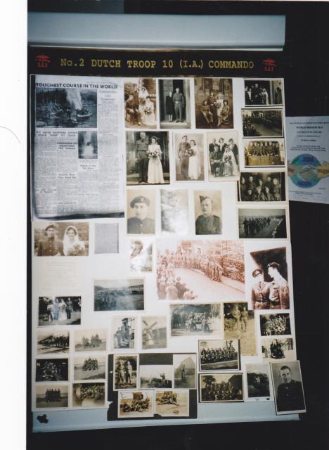 Display board (1) of photos of Dutch troop 10IA Cdo.