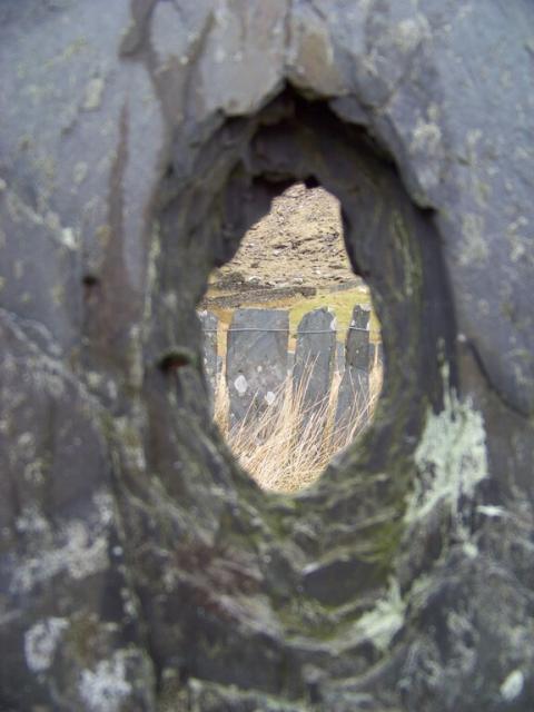 Bullet holes in slate fence