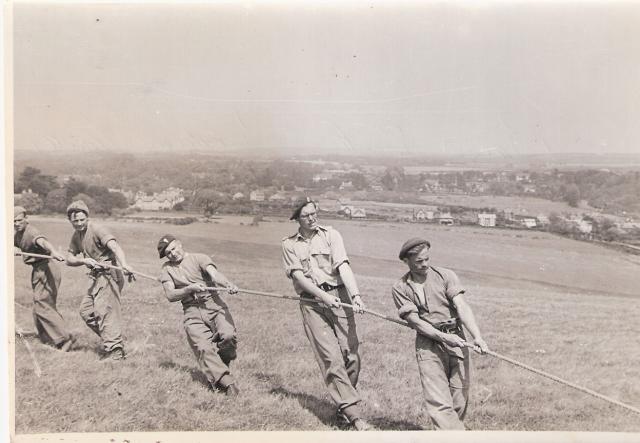 J. Barry (on the right), Lt. Ian Smith (2nd from right), CSM Sam Brodison (3rd), and LCpl. Ellis Howells (4th).