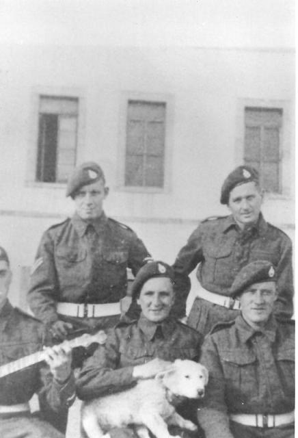 L/Cpl. Eddie Webb holding the dog,  and others