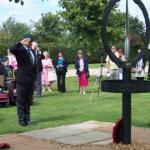 Geoff Murray salutes during the wreath-laying ceremony