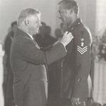 Sgt. Simon Wagstaff B.E.M. receiving his award from Chris Patton, Governor of Hong Kong.