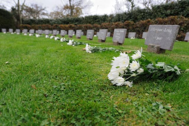 Flowers on the graves of the civilians who died