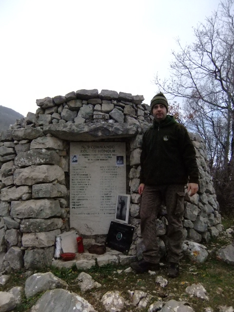 Salvatore beside the Commando Monument at Mount Ornito