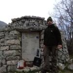 Salvatore beside the Commando Monument at Mount Ornito