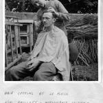 L/Cpl. Phillott cutting the hair of L/Cpl. 'Ken' Emmerson at le Plein