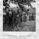 "Volunteers receive their issue of beer"  near Le Mesnil, August 1944