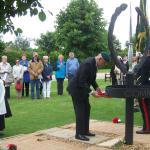 Brigadier Thomas places The Wreath at the base of The CVA Memorial