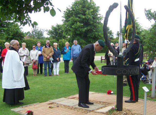 Brigadier Thomas places The Wreath at the base of The CVA Memorial