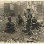 Brian Butler MC (left), unknown, Lt. Williams (standing), John Alderson MC (right)