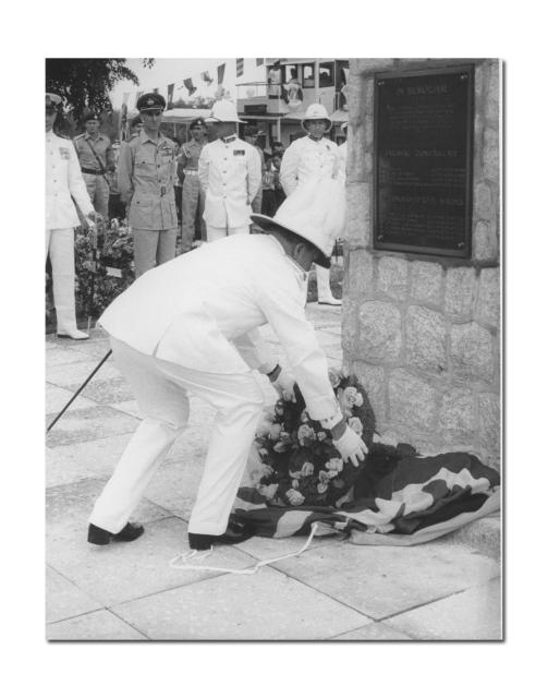 Sir Alexander Waddell KCMG, DSC, Governer of Sarawak, laying a wreath at Limbang.