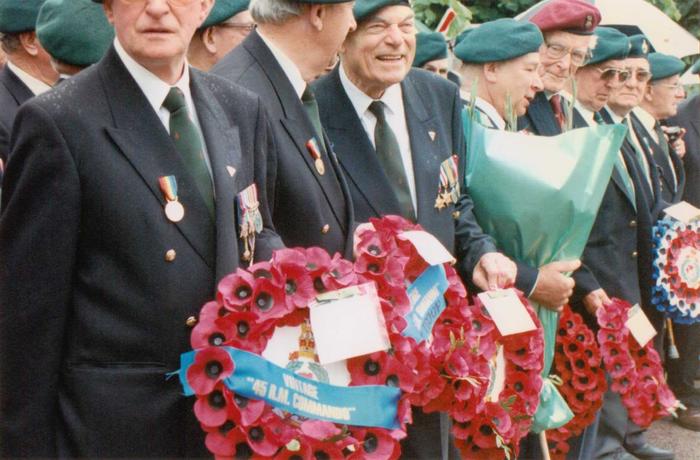 Veterans waiting with wreaths at the 45RM Cdo monument.