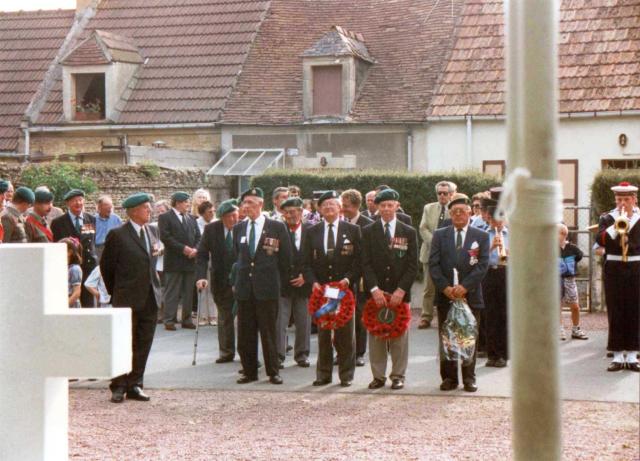 Sgt. Jack Sinclair looks on as Veterans wait to lay wreaths at the 45RM Cdo memorial at le Plein