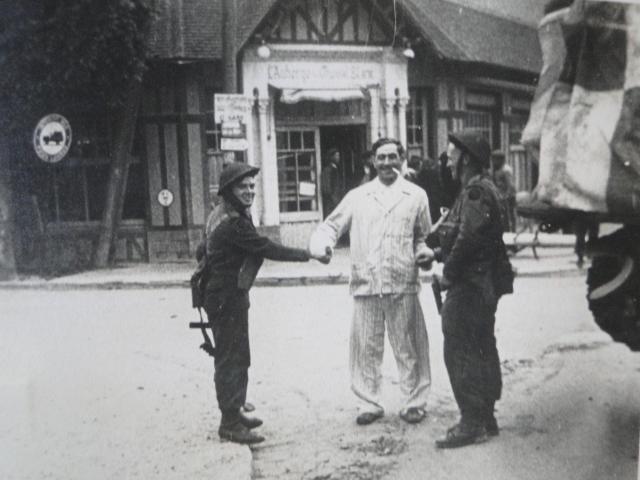 Capt. Porteous VC and McIver being greeted in Ouistreham