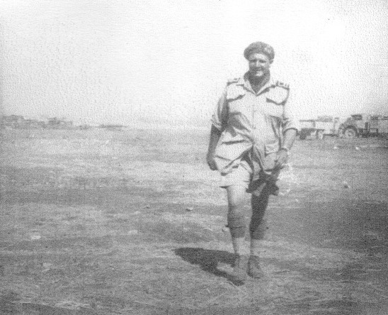 Lt Thomas Turton RNVR on one of the Bark West beaches in Sicily following Operation Husky