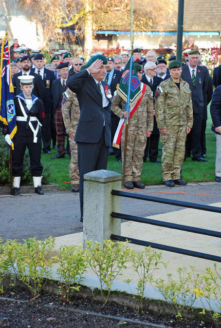 Brigader Jack Thomas saluting the memorial at Fort william