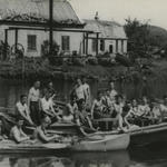 Thomas McGuinness and others in boats