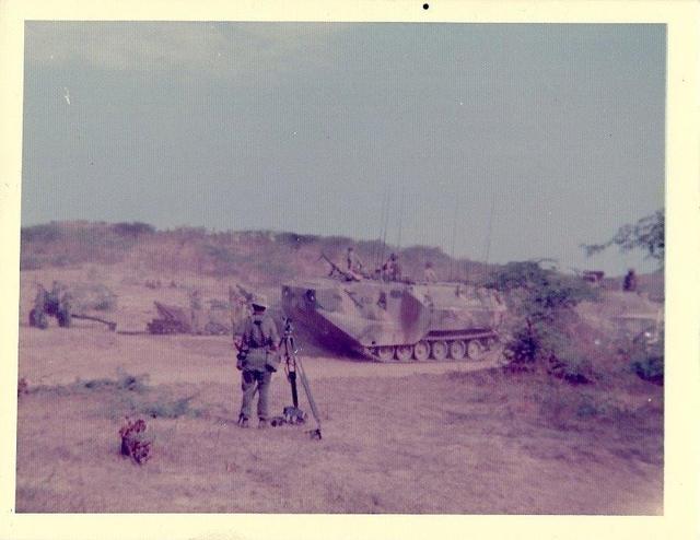 US Marines Amtrac going through 79 Commando Light Bty Gun Position