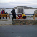 Lighting candles in memory of the lost on HMS Affray