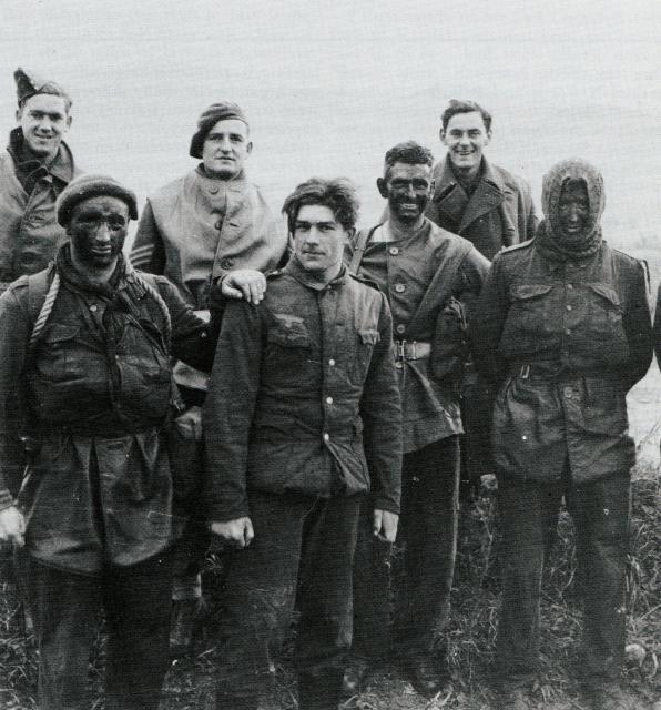 Men of 9 Commando, with a German prisoner, after their raid on the Garigliano Estuary defences, Dec 1943