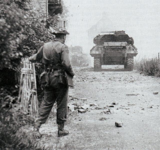 Lt Col Moulton, 48 RM Commando,directing the fire of tanks supporting the attack on Langrune strongpoint D+1, 7th June 1944