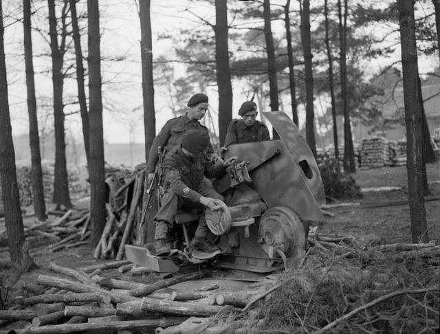 C/Sgt Gray, Sgt Harrison, and Mne Hedges, 45RM Cdo., with captured gun