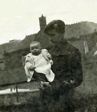 Patrick Wells holding his daughter Sheila