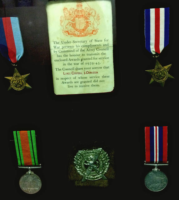 Medals and cap badge of LCpl. John Donaldson No 2 Commando