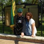 Fred Davies shows Anne George her father's paver