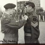 Sgt. Cyril Dobbs receiving his MM from Montgomery