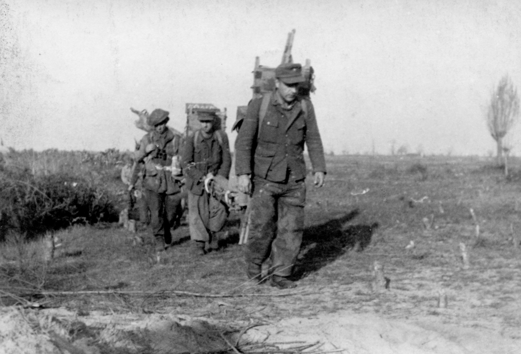 No. 2 Commandos with prisoners carrying equipment