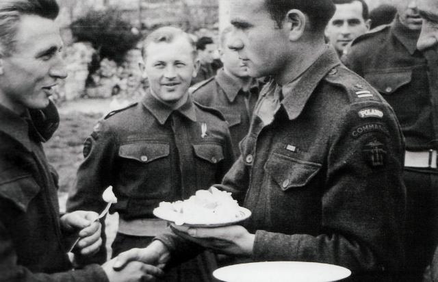 A decorated Polish Major greets a comrade.