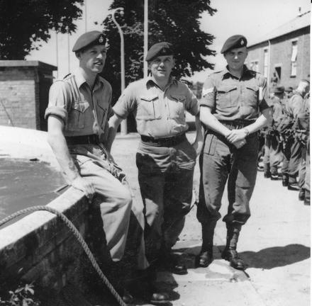 Cpl. Jack French, Sgt Wilkinson, and Cpl. Kennedy by the old water tank outside Brick Gym at CTCRM