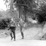 The Padre Rev. Taylor RN on the Endurance Course Pass Out and instructor Cpl.David Prichard RM.