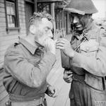 Commandos have a cigarette after returning to Newhaven from Dieppe