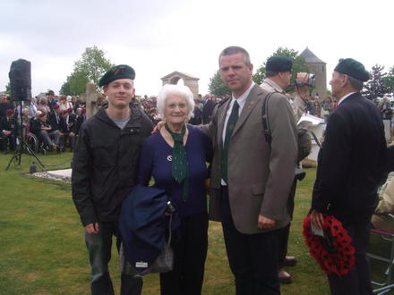 Muriel, widow of John Lilley, with her grandson and Stéphane, Ranville cemetery 6th June 2010.