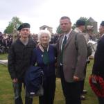 Muriel, widow of John Lilley, with her grandson and Stéphane, Ranville cemetery 6th June 2010.