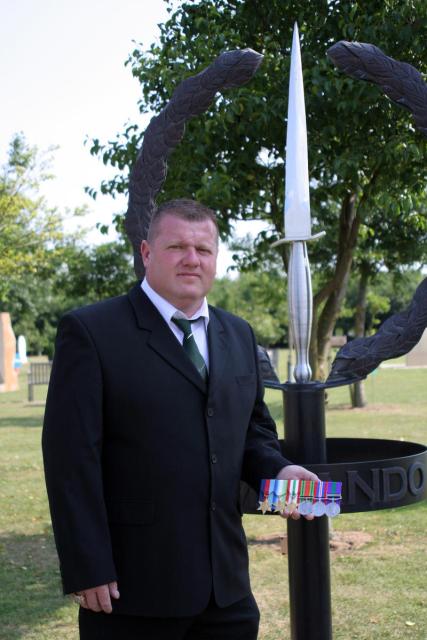 Mark Heard with his father's medals