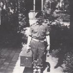 C /Sgt Bob 'Beau' Ghest carrying the radio set