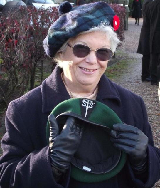 Janet Bishop with Bob's green beret