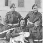 LCpl. Eddie Webb holding the dog, and others, 43RM Commando 'E' troop.