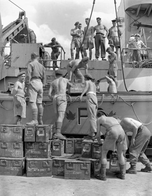 Commandos from No.2 loading ammunition on board LCA