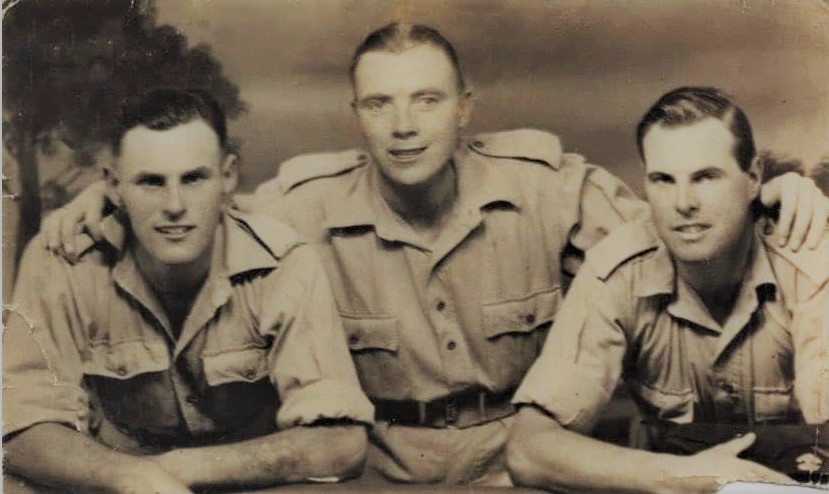 Pte Ronald Voller (centre) and others