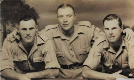 Pte Ronald Voller (centre) and others