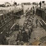 Commandos and Pioneer Corps, Beach Company, unload stores at Walcheren