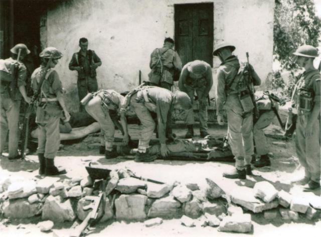No 2 Commando attend to wounded at the R.A.P., Spilje, Albania (Operation Healing II)