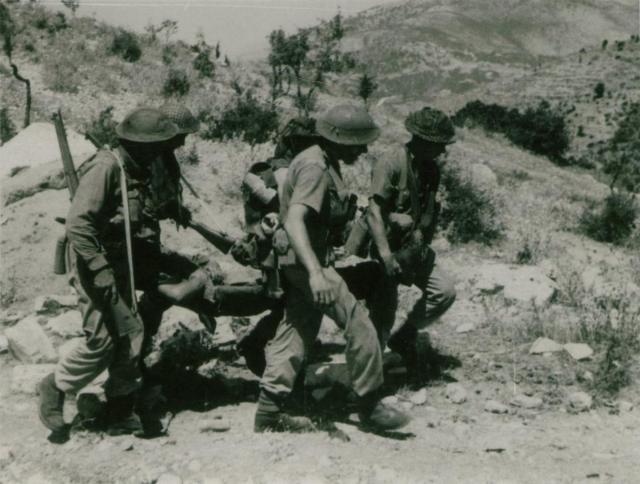 No.2 Cdos carrying wounded at Spilje, Operation Healing 2 - 29th July 1944.
