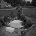 The plinth for the No.6 Cdo Memorial being laid at Le Plein, Amfreville