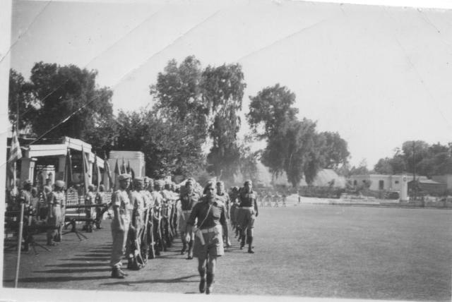 Raiding Forces Signal Squadron marches past the C in C ME