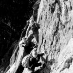 Cpl. Bill Barnes, No.4 Commando, and others, free climbing in Scotland